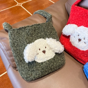 Detailed close-up of fluffy plush tote bag with cute 3D puppy patch on faux fur texture