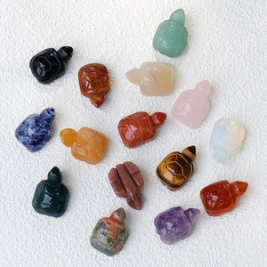 Hand-carved natural crystal and gemstone turtle figurines in various colorful minerals