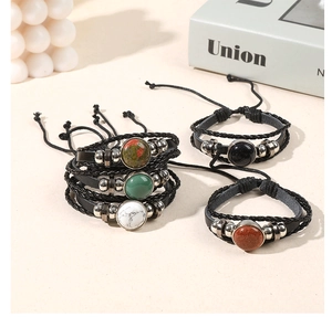 Artistic collection of multilayer braided leather bracelets with natural crystal gemstones