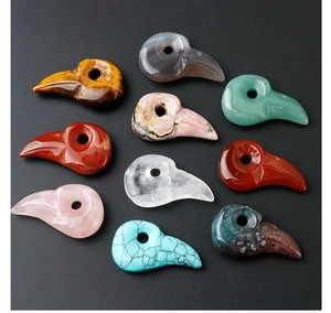 Variety of hand-carved natural stone bird skull charms for jewelry making in ten colors