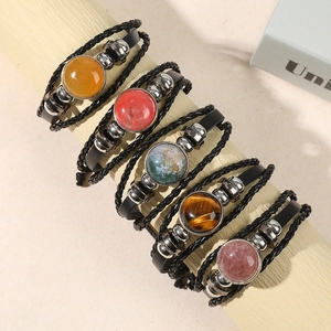 Five-piece multi-layer leather bracelet set with natural gemstones on wooden stand