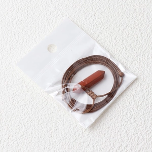 Minimalist red jasper hexagonal pillar pendant necklace with brown braided cord