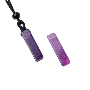 Natural amethyst rectangular pillar pendant necklace with black cord on white background