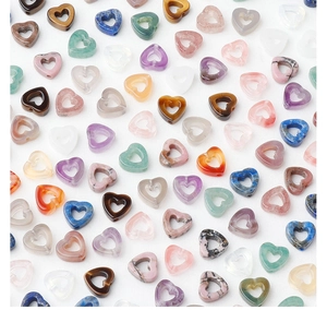 Macro shot of assorted heart-shaped natural crystal gemstone beads for DIY jewelry making