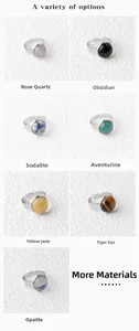 Detail of seven 15mm natural stone rings featuring rose quartz and opalite in silver settings