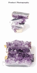 Macro shot of polished purple amethyst slice pendant with gold and silver metal edges