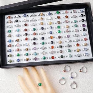 Bulk 11mm natural stone rings in assorted colors with stainless steel settings in box