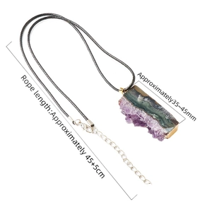 Natural amethyst crystal pendant necklace with gold plated edges and black woven cord