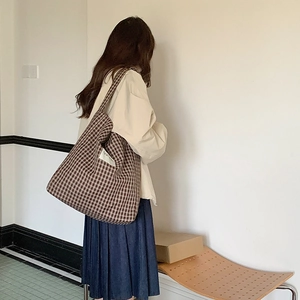 Brown gingham canvas tote bag detail showing large capacity and wide shoulder strap