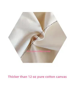 Detail shot of heavy-duty 16oz cotton canvas fabric with thick woven texture and cream finish