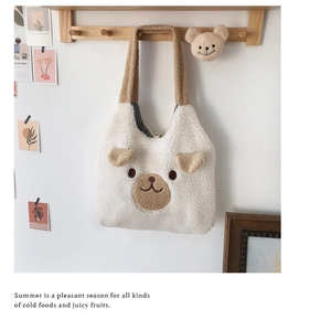 Detail of plush bear bag showing soft sherpa texture and checkered lining interior