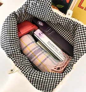 Spacious interior of white plush tote bag showing capacity for iPad, books and scarf