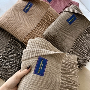 Thick checkered cashmere-feel scarf with tassels in elegant earth tones for winter