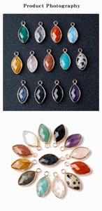 Macro detail of multicolored marquise crystal pendants with golden copper-edged frames
