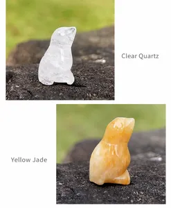Detail of hand-carved animal figurines in clear quartz and yellow jade stones