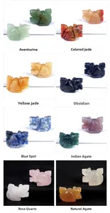 Detail of 1-inch hand-carved squirrel figurines in various natural crystal and agate stones