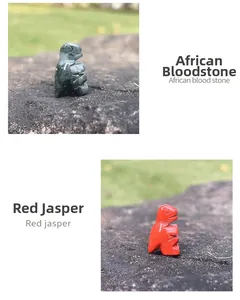 Detailed stone carvings of a dinosaur in African blood stone and red jasper
