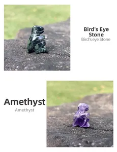 Macro detail of bird's eye stone and amethyst dinosaur carvings on natural rock surface