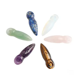 Macro detail of six natural gemstone goddess pendants in amethyst and tiger eye crystals