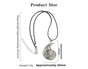Detailed view of nautilus shell pendant with abalone inlay and dimension measurements