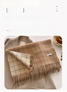 Detail view of plaid cashmere scarf with tassels showing 204x53cm dimensions