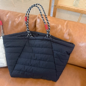 Black quilted cloud tote bag with stylish black and white braided rope handles