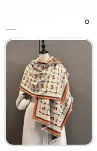 Detailed view of the equestrian horse pattern and fringe on the imitation cashmere scarf