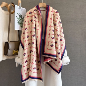 Elegant beige cashmere-like scarf with horse head jacquard and fringe details