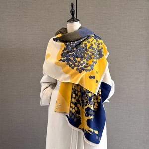Autumn vintage scarf with tree jacquard and tassels on model over white coat