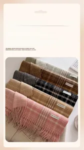 Close-up of five color options for plaid scarves with long tassels and soft texture