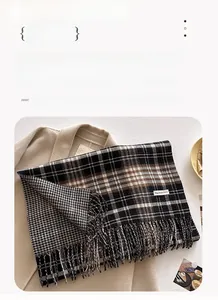 Macro detail of plaid scarf with tassels showing 204x53cm size dimensions and textures