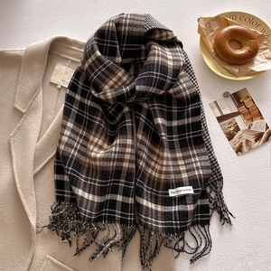 Classic checkered plaid scarf with tassels and thick warm texture for winter outfits