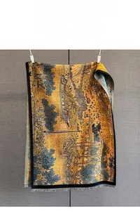 Detailed view of the fine jacquard knit and traditional landscape pattern with fringes
