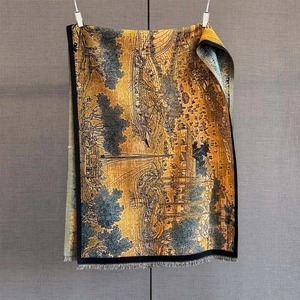 Golden cashmere-like scarf with landscape jacquard pattern and elegant fringed edges