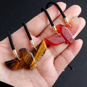 Handcrafted tiger eye and red agate eagle pendant necklaces with black braided cords