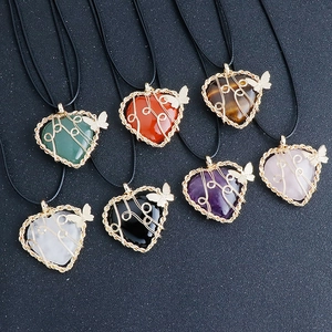Set of seven heart-shaped gemstone necklaces with gold wire-wrapped butterfly charms