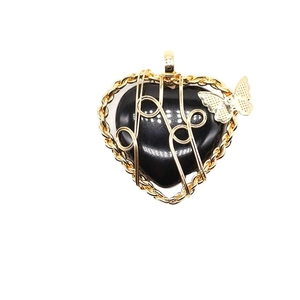Natural heart-shaped black stone necklace with gold wire wrap and butterfly pendant charm
