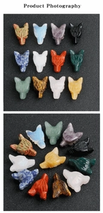 Detailed view of hand-carved natural wolf head gemstone pendants in various crystals
