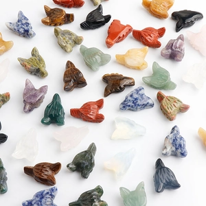 Assorted natural gemstone wolf head carvings featuring amethyst quartz and tiger eye stones