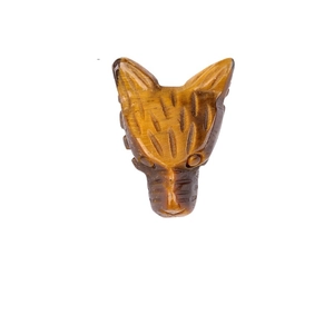 Natural tiger eye stone wolf head carving pendant with detailed fur texture on white background