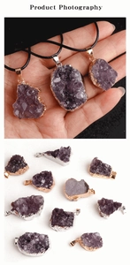 Detailed close-up of raw amethyst cluster pendants with gold and silver electroplated edges