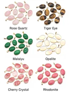 Macro view of assorted oval semi-precious agate pendants with gold-plated copper edges