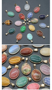 Macro shot of oval gemstone pendants with golden edges featuring tiger eye and quartz