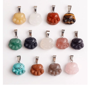 Flat lay of 13 colorful cat paw gemstone pendants with polished textures and metal clasps