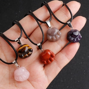 Natural gemstone paw pendants in rose quartz and amethyst with black woven cord necklace