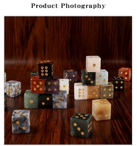 Macro shot of gemstone dice with gold numbers on a walnut wood background