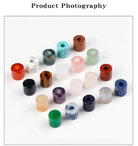 Macro view of assorted natural stone cylinder beads for DIY jewelry making and crafts