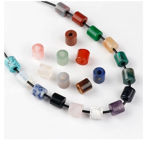 Macro shot of assorted colorful natural stone cylinder beads for DIY jewelry making