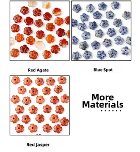 Detailed view of flower-shaped natural stone beads in red agate, blue spot jade and red jasper