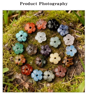 Macro detail of plum blossom gemstone beads on moss with natural tree bark background
